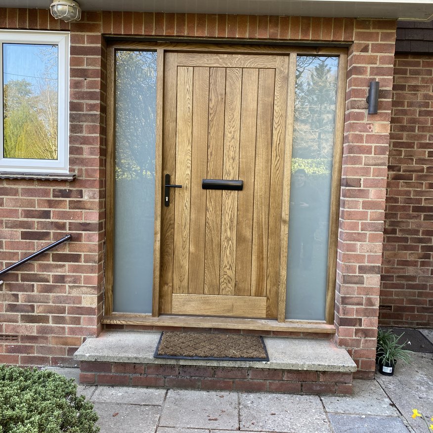 Solid Oak boarded bespoke door entrance. Finished in Raw Osmo oil.