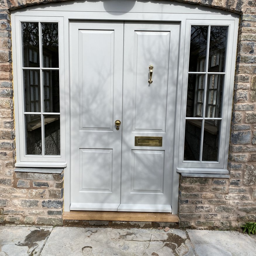 Bespoke Accoya door and doorframe with raised and fielded panels. Little Greene paint