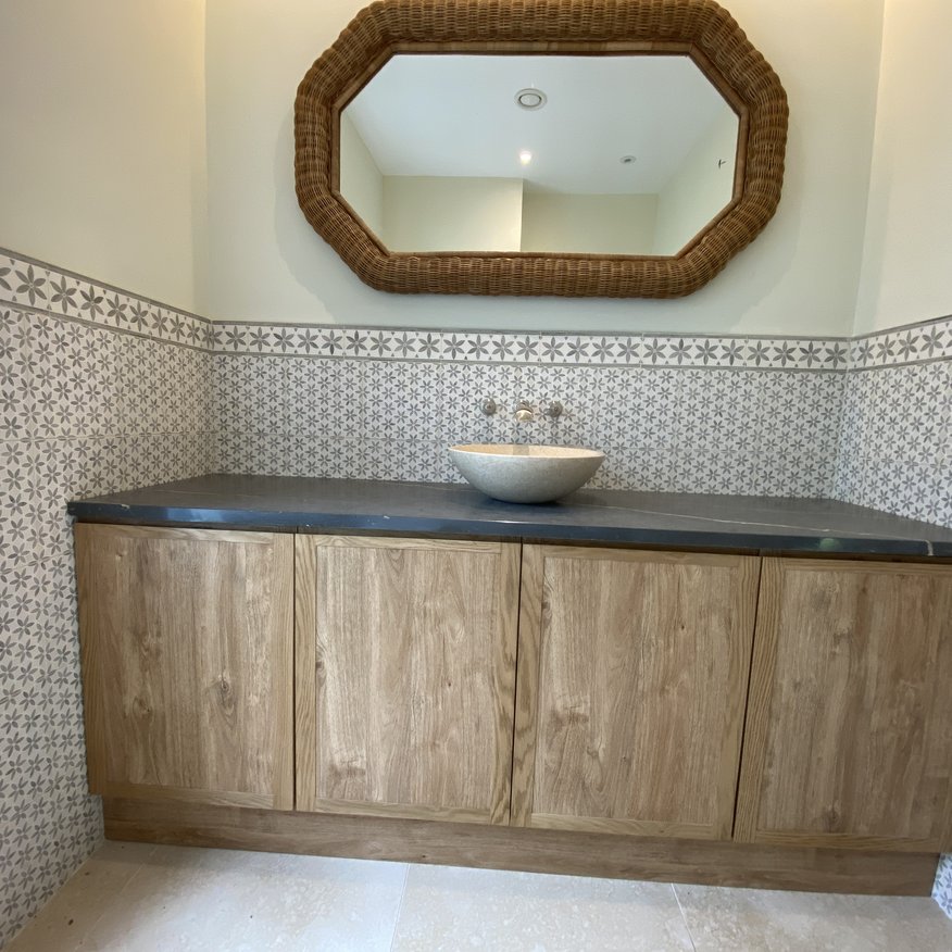 Bespoke bathroom vanity unit made from oak with a solid Blue Lias worktop